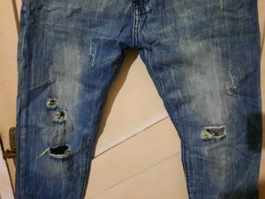 2 numbers of Distressed Blue Jeans
