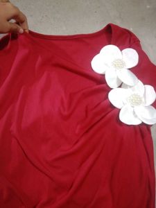 Chic Red Top with Floral Accent