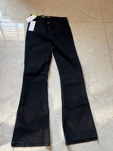 Trendy shredded bottom Black Flare Jeans