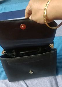Stylish Black Handbag with Gold Chain Detail