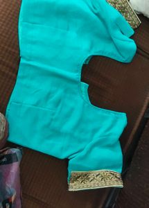 Elegant Teal Blouse with Golden Trim