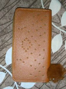 Stylish Tan Wallet with Pom-Pom Charm
