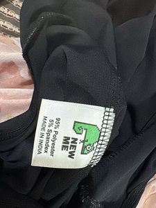 Newme Black Open Back Flare Jumpsuit