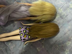 Two Barbie Dolls with Dresses