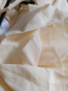 Cream Off-Shoulder Jumpsuit with Tie-Up Sleeves