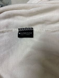 OZBRIDGE SHEER TURTLE NECK TOP