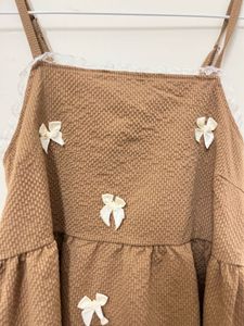 Cute Brown Textured Dress with Bows