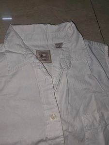 Classic White Sleeveless Button-Up Shirt