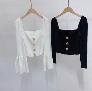 Chic Black Top with gold buttons
