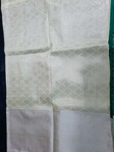 Elegant Teal Saree with Silver Floral Motifs