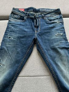 Distressed Blue Denim Jeans
