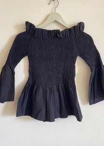 Black Off-Shoulder Smocked Peplum Top