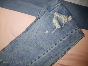 Distressed Blue Denim Jeans