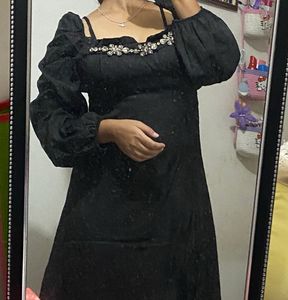 Elegant Black Dress with Embellished Neckline