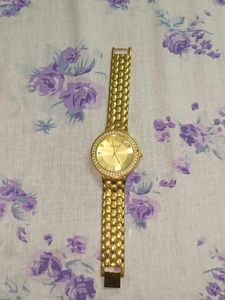 Elegant Gold Tone Watch with Crystal Accents