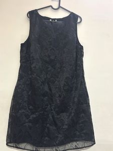 Shiny reflecting black dress