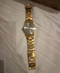 LOIS CARON Gold Pleated Watch For Men..