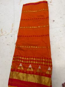 Vibrant Orange Saree with Golden Accents