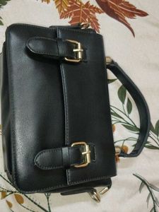 Chic Black Handbag with Buckle Detail