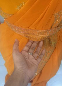 Elegant Orange Saree with Embellishments