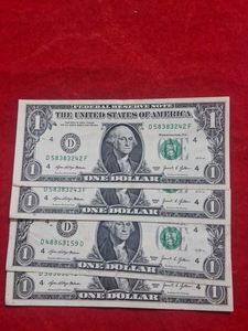 Four US Dollar Bills