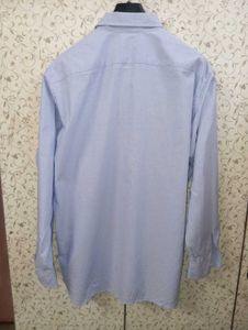 uniqlo light blue half button shirt