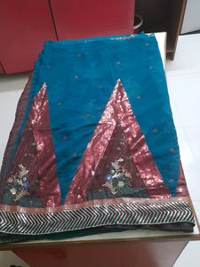 Party Wear Saree.Belive Me Its Too Preety, I Dont Wear Sarees So M Selling.Beautiful Sequence Pattern.colour Is Dark Green ,not Blue