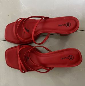 Unused red heels
