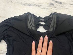 Black Top With A Net Neckline