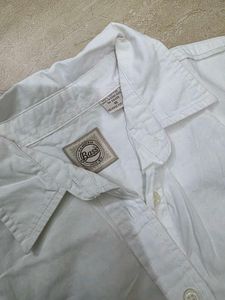 Classic White Sleeveless Button-Up Shirt