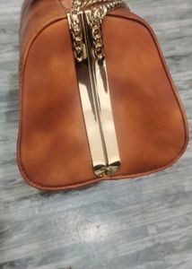 Elegant Brown Clutch with Chain Detail