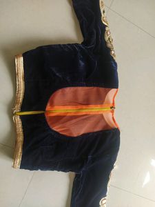 Velvet blouse with net dupatta and lahenga.    nav