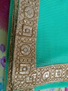 Elegant Teal Saree with Gold Border