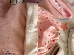 baby mittens,caps, and socks. 7 pairs