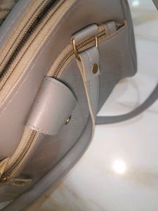 Grey sling bag
