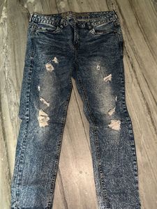 Distressed Blue Denim Jeans
