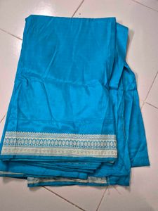 Vibrant Teal Saree with Striped Blouse
