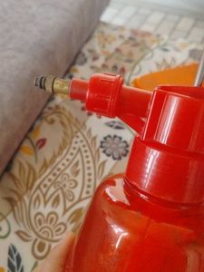 Red Spray Bottle for cleaning windows