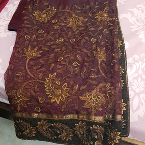 Silk type maroon saree with golden embroidery and
