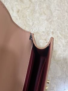 beige sling bag