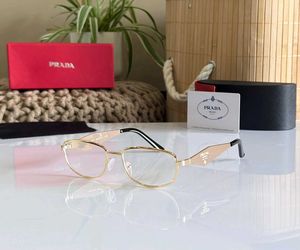 Prada Gold Frame Eyeglasses