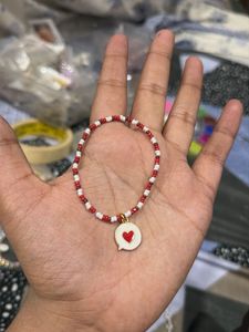red and white seed beads bracelets with heart mess