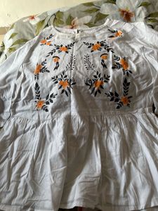 Embroidered White Peplum Top