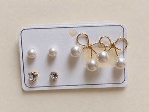 Elegant Gold Bow Earrings with Pearl Drops 🩷
