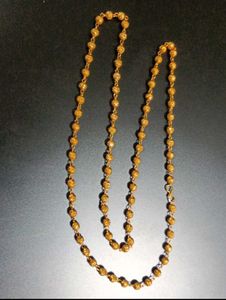 Elegant Gold Beaded Necklace with Swastik