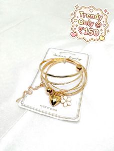 Set of 4 Gold Bangles with Charms