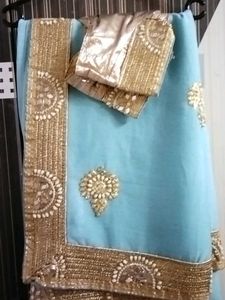 Stunning Blue Saree with Golden Embellishments