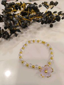 Charming Beaded Bracelet with Flower Charm