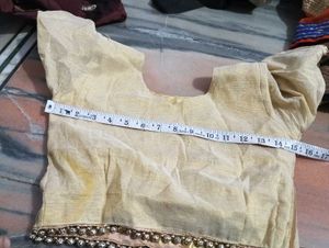 dark brown lehga with golden duppatta and blouse