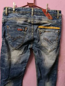 Distressed Blue Denim Jeans